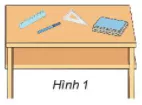 Em viết vào vở: Tên các đồ vật trên bàn ở Hình 1 Hoat Dong Kham Pha Trang 8 Toan Lop 6 Tap 1 Chan Troi